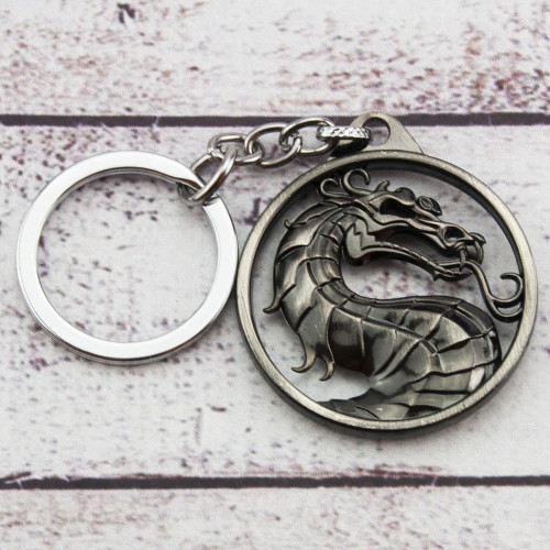 Брелок БКИМ 2010 Мортал Комбат логотип (серебро антик)